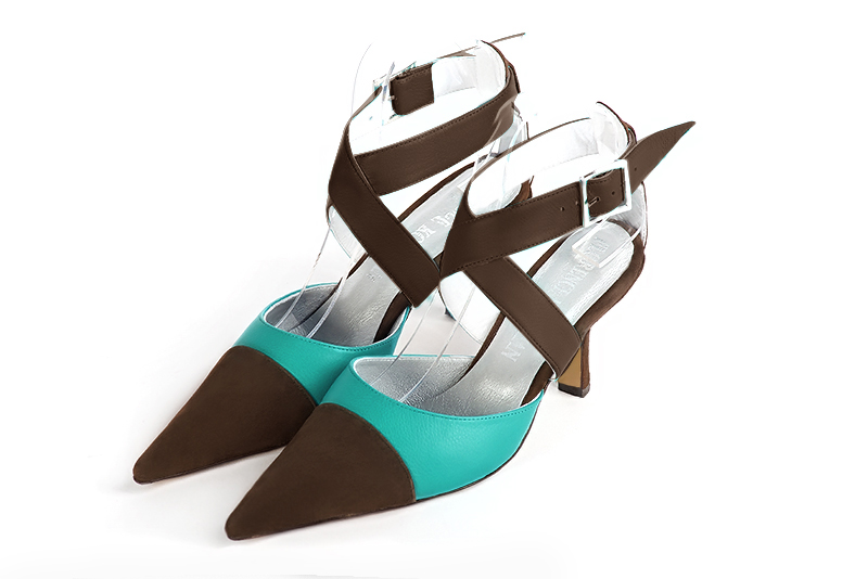 Dark brown and aquamarine blue women's open back shoes, with crossed straps. Pointed toe. High spool heels. Front view - Florence KOOIJMAN